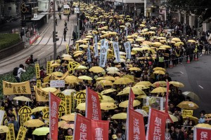 Demonstrators march for democracy in Hong Kong on February 1, 2015. Tens of thousands of people were to take to the streets of to continue pushing for democracy, in the first major rally since protesters occupied stretches of highways. AFP PHOTO / Philippe Lopez